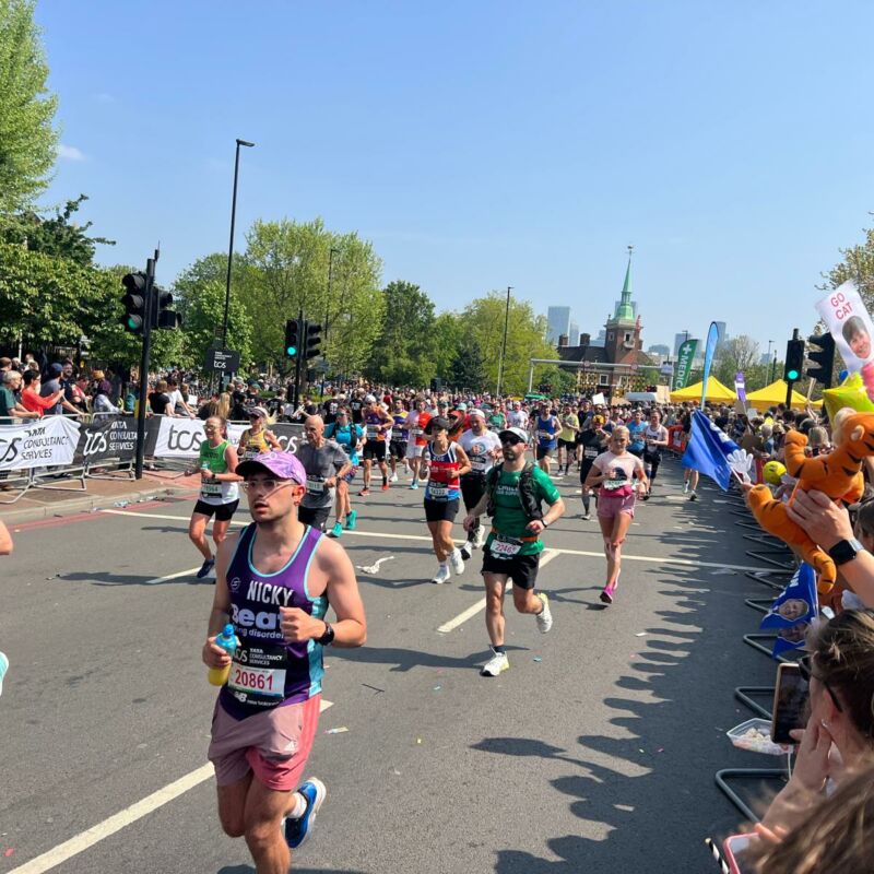 London Marathon 2025 runners at Canada Water mile nine