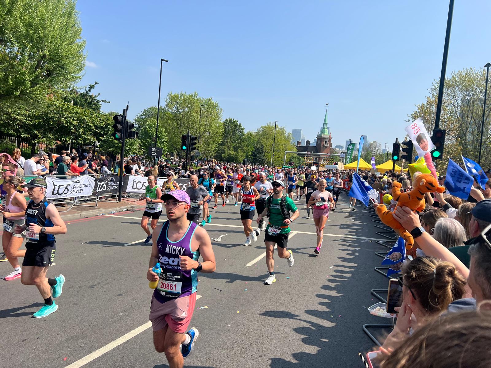 London Marathon 2025 runners at Canada Water mile nine